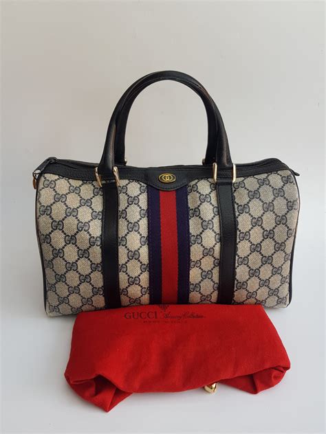 navy blue gucci boston bag|blue gucci bag vintage.